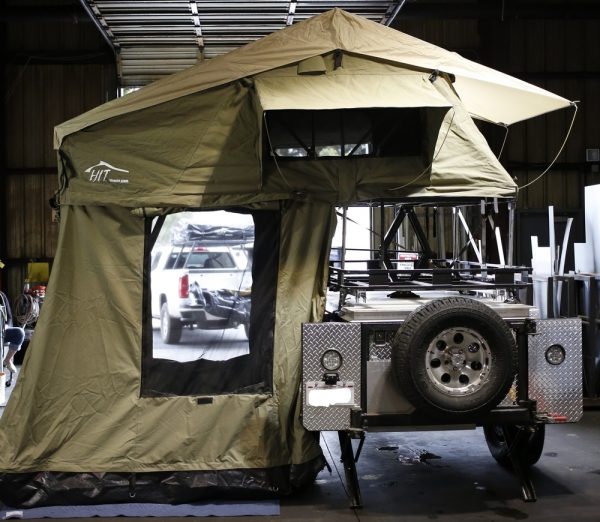A vehicle with a setup of Expedition Grade Rincon and awning combo.