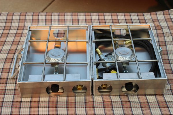 A Partner Steel 9" folding stove sits on a checkered table.