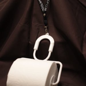 A Poo-lahoop™ tissue holder with lanyard.